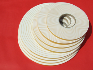 Insulation Tape white available in a variety of lengths and thicknesses on cardboard tubes.