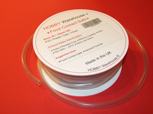 Tube for beer and wine making and syphoning on a white spool/drum.